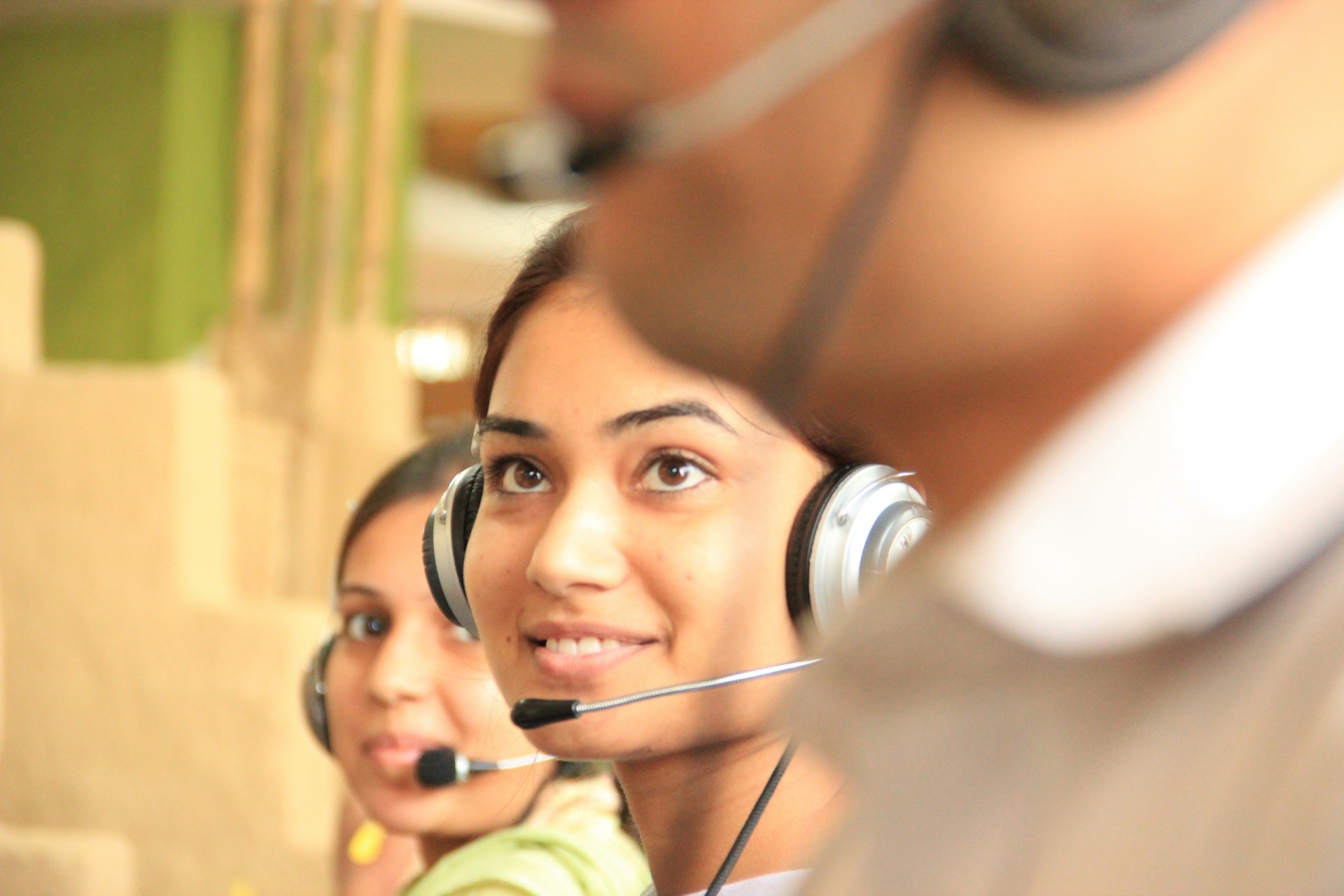 Customer support advisors wearing headsets