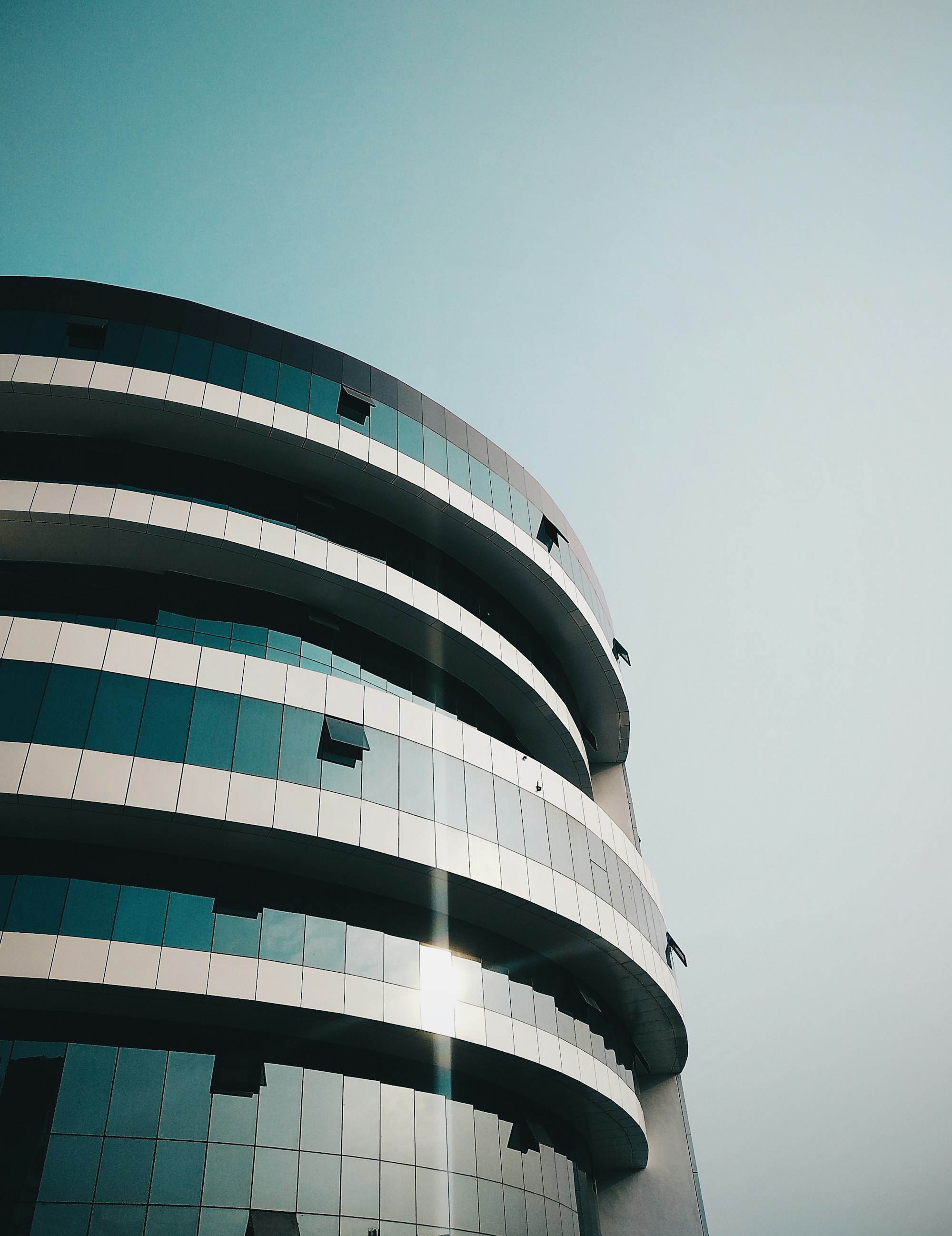 A modern office building against a clear sky