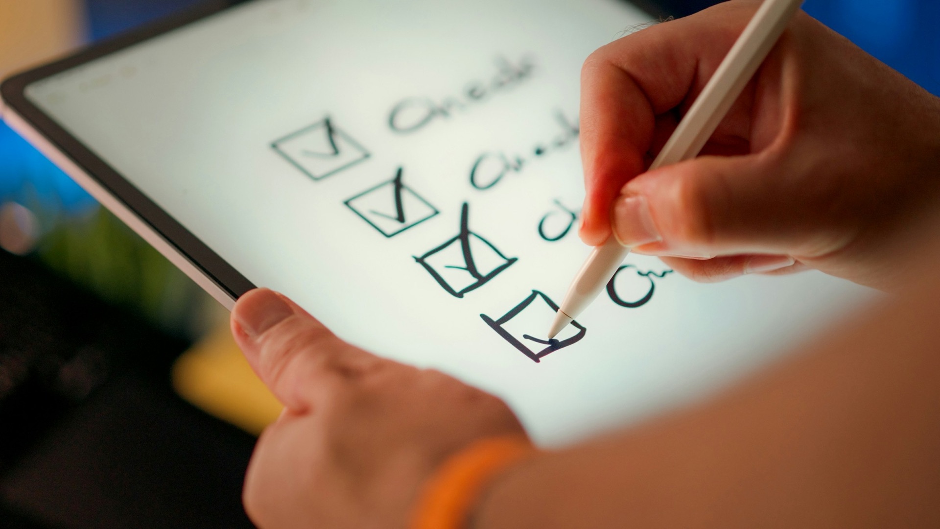 A hand ticking off a checklist