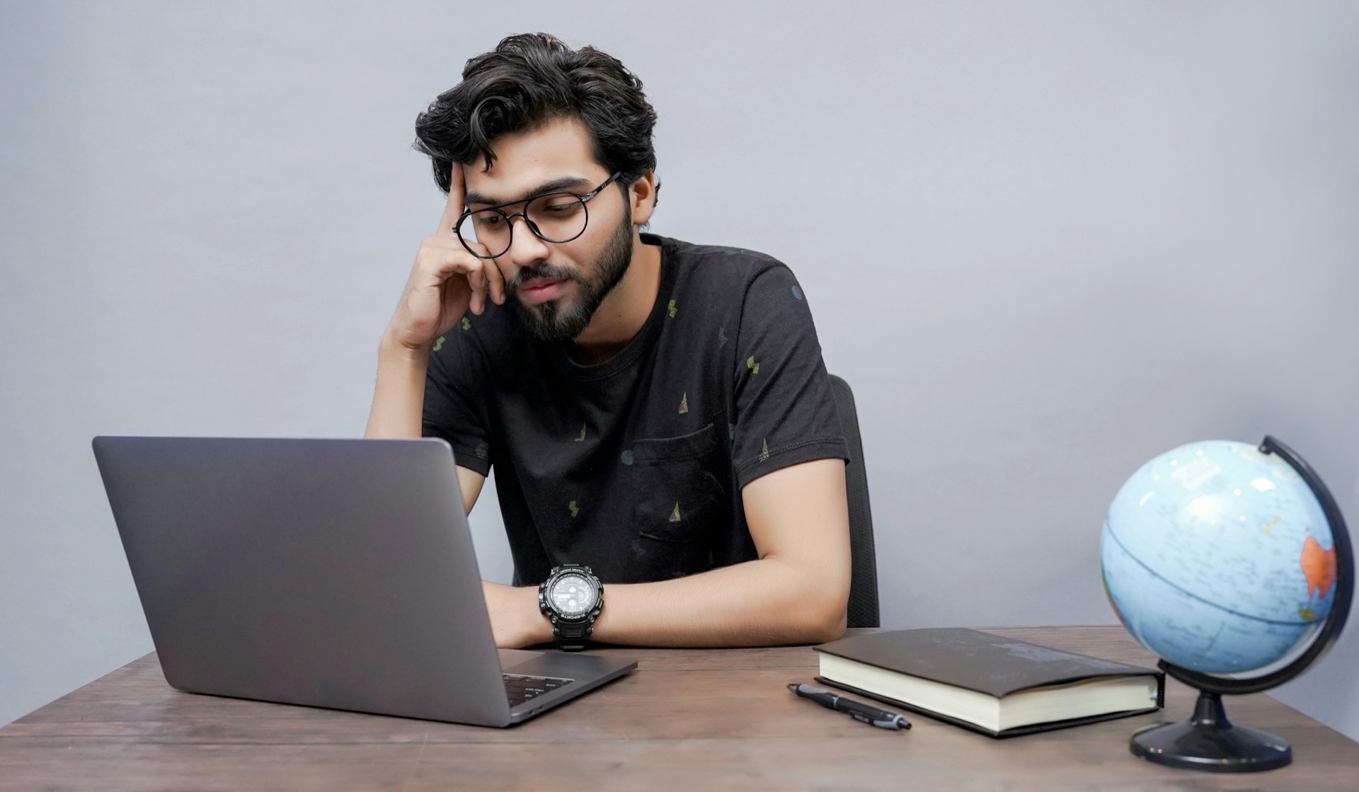 A young professional working on a laptop